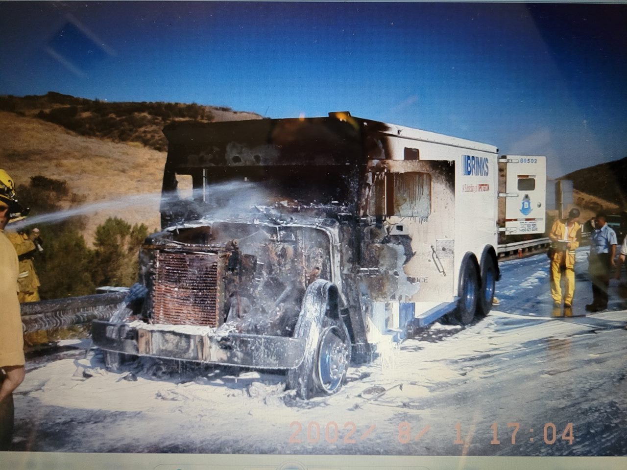 Foam being applied to a vehicle fire, August 2002